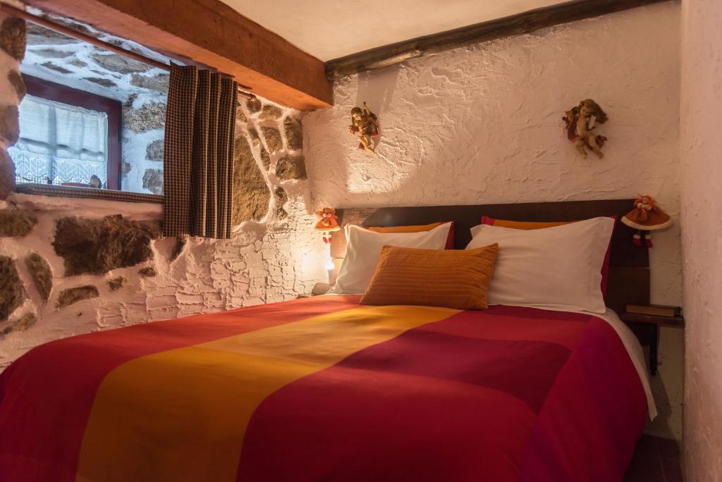 Postel nebo postele na pokoji v ubytování Casas da Fonte - Serra da Estrela