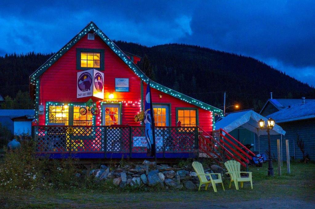 a house with christmas lights on the front of it at Mountain Thyme Getaway in Barkerville