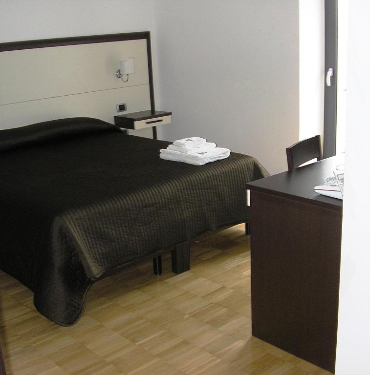Postel nebo postele na pokoji v ubytování Baja delle Sirene