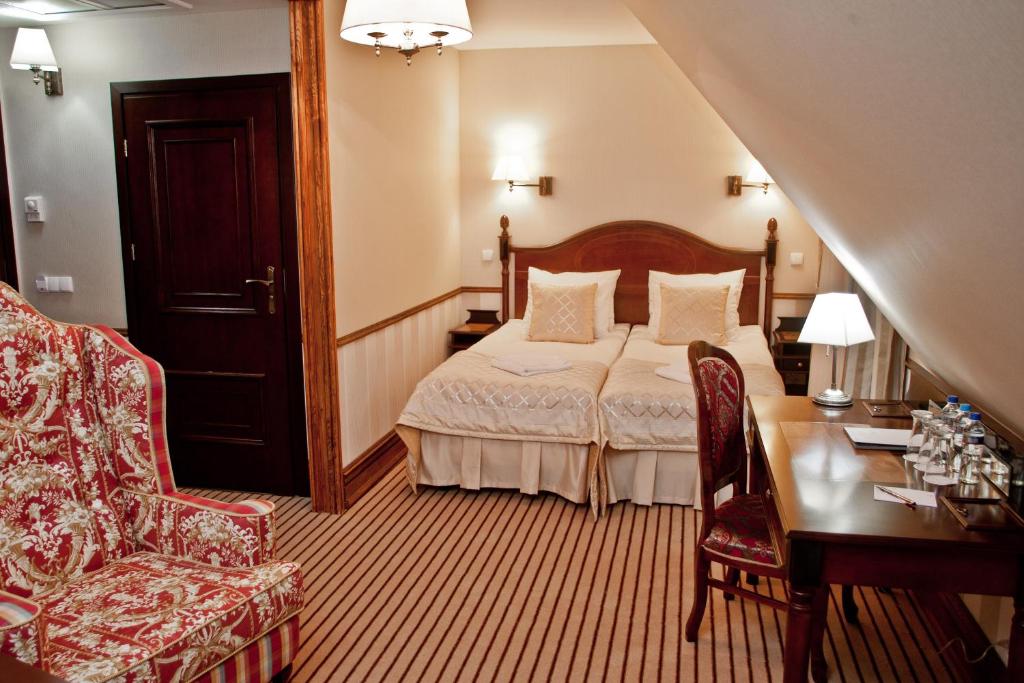 Postel nebo postele na pokoji v ubytování Hotel St. Bruno
