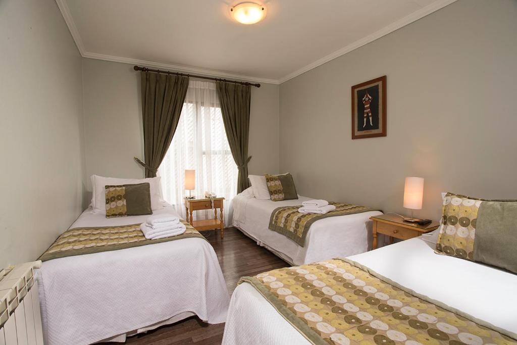 Postel nebo postele na pokoji v ubytování Hotel Carpa Manzano