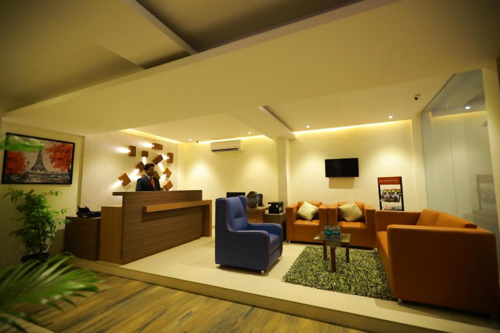 TV a/nebo společenská místnost v ubytování Prime Palace Hotel - MG Road