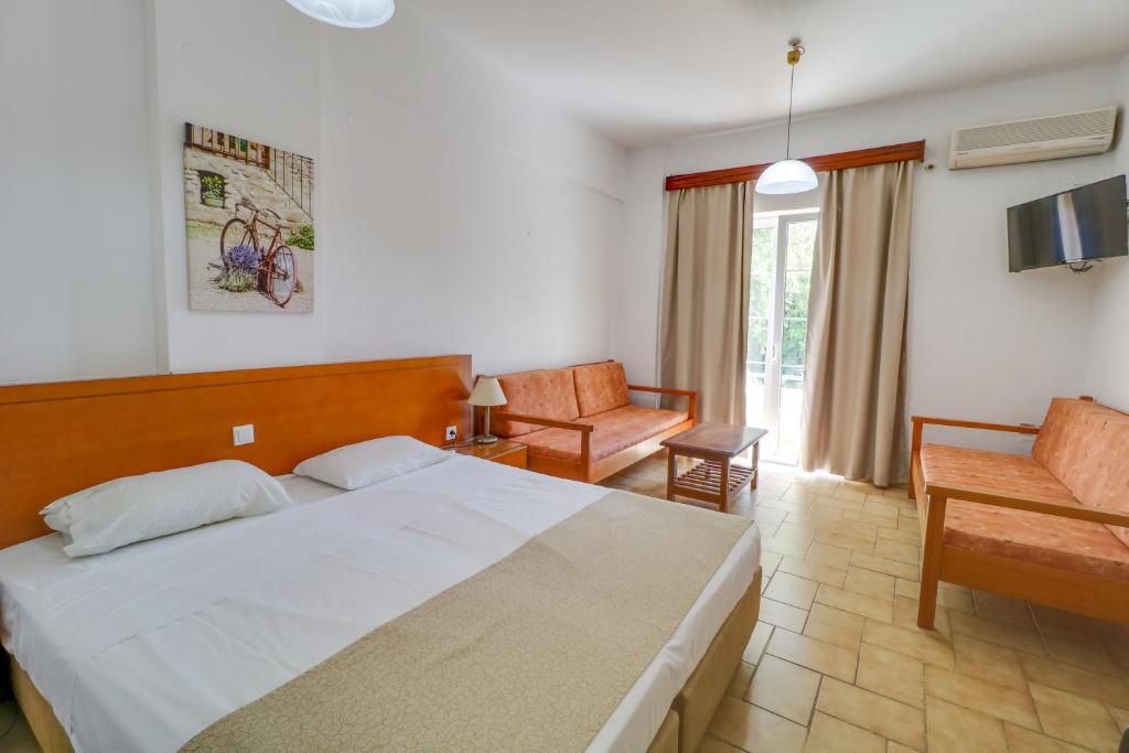 Postel nebo postele na pokoji v ubytování Marirena Hotel