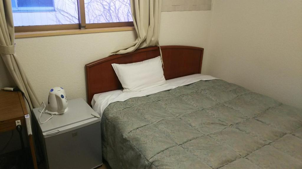 Postel nebo postele na pokoji v ubytování Itoen Hotel Hakone Yumoto