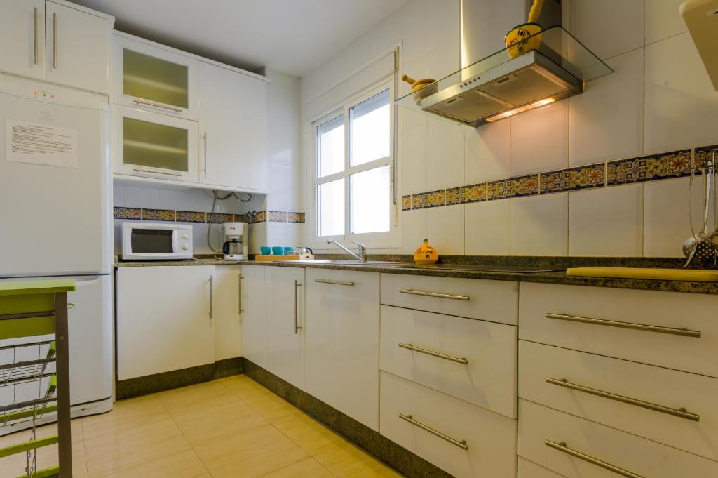 Kuchyňa alebo kuchynka v ubytovaní Apartamentos Rotonda
