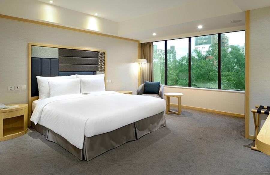 Postel nebo postele na pokoji v ubytování Sonnien Hotel
