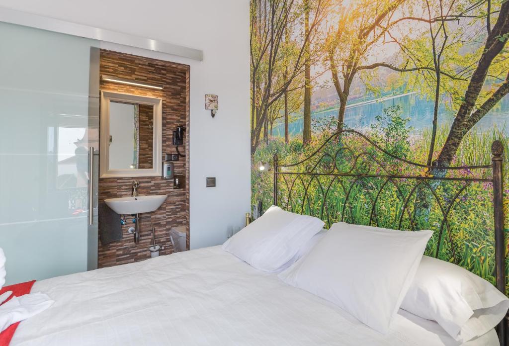 Cama o camas de una habitación en Salamandra Plaza