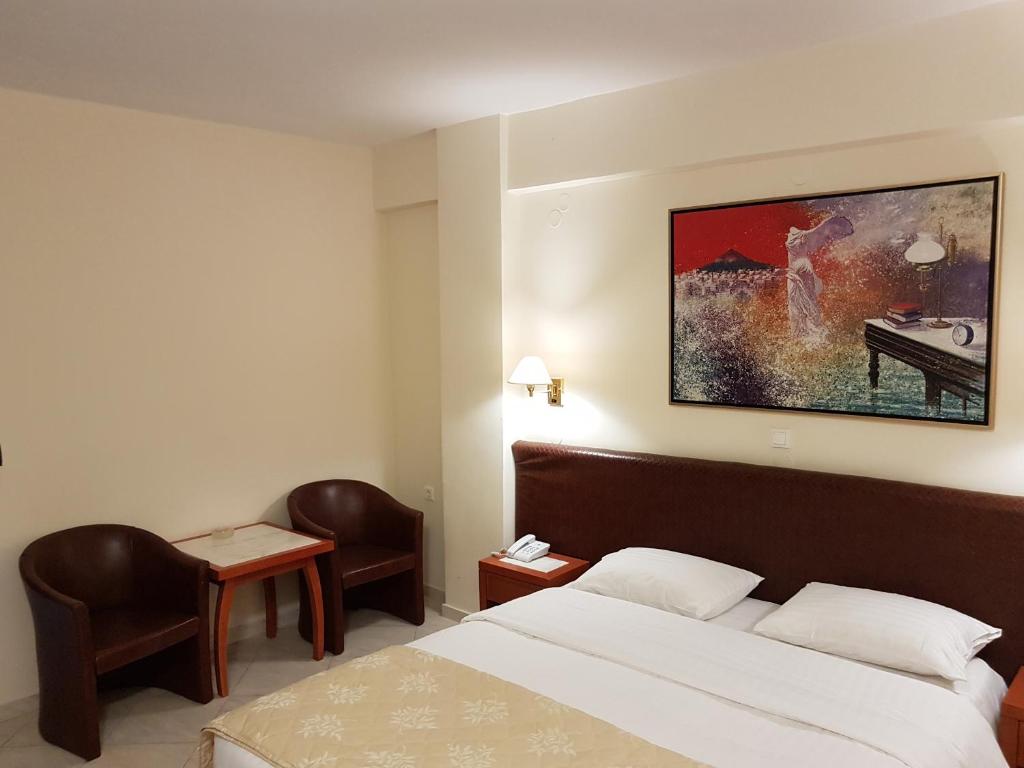Postel nebo postele na pokoji v ubytování Liberty Hotel