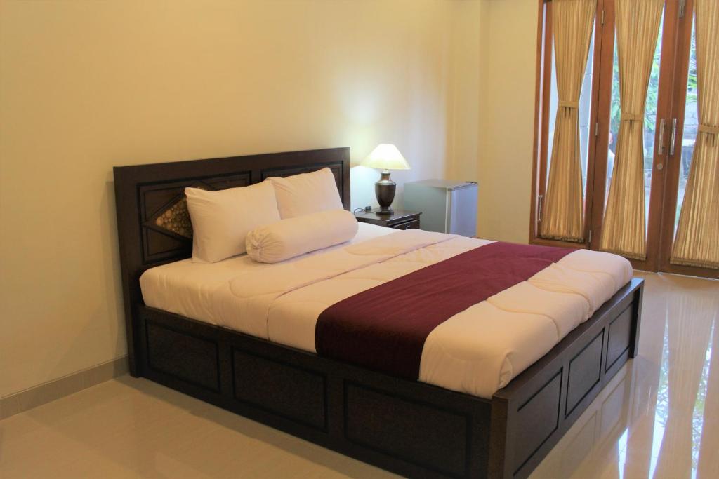 Postel nebo postele na pokoji v ubytování Mekenyem House Ubud