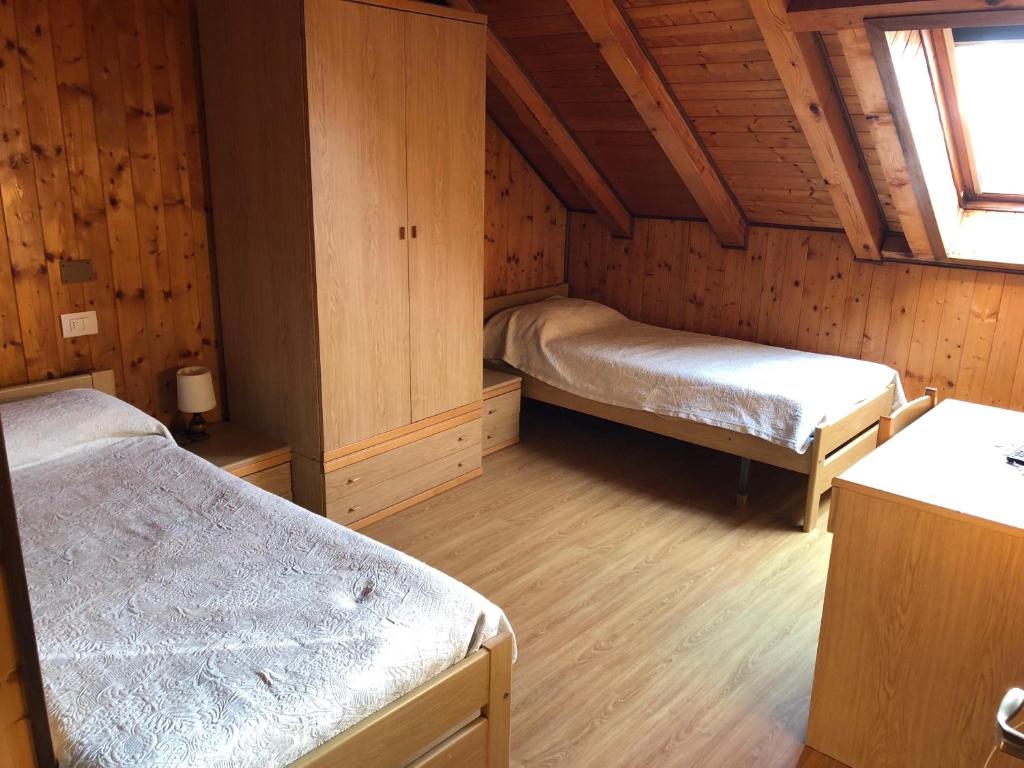 Postel nebo postele na pokoji v ubytování Albergo La Perla