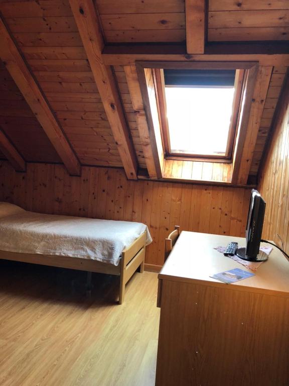 Postel nebo postele na pokoji v ubytování Albergo La Perla