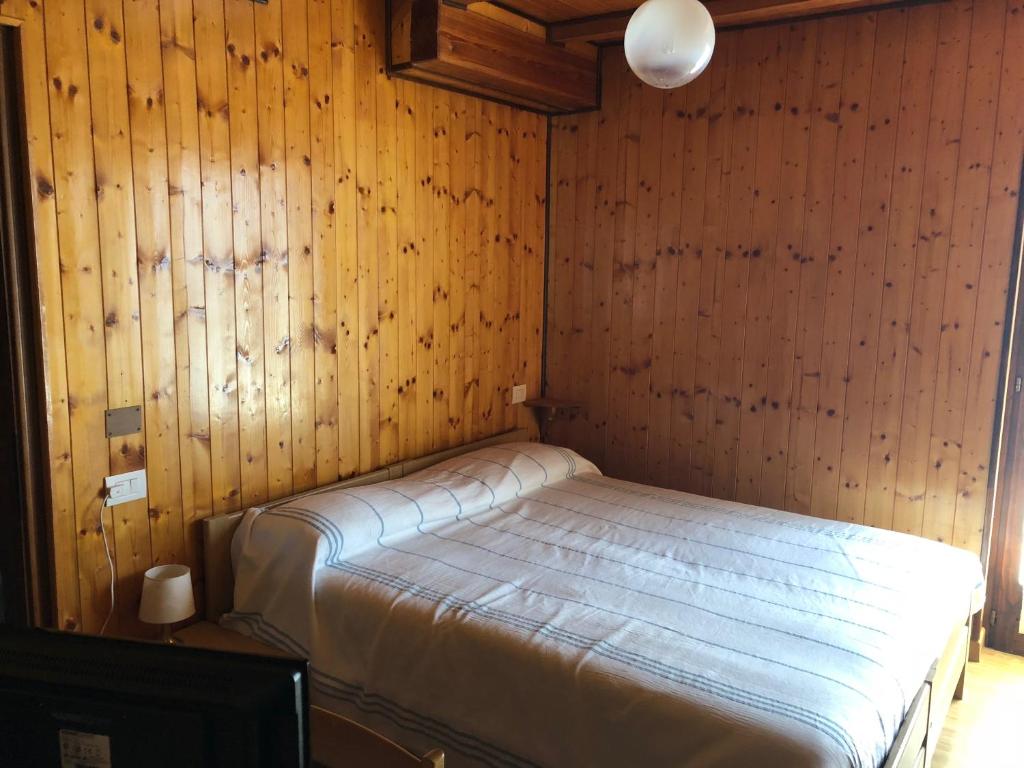 Postel nebo postele na pokoji v ubytování Albergo La Perla