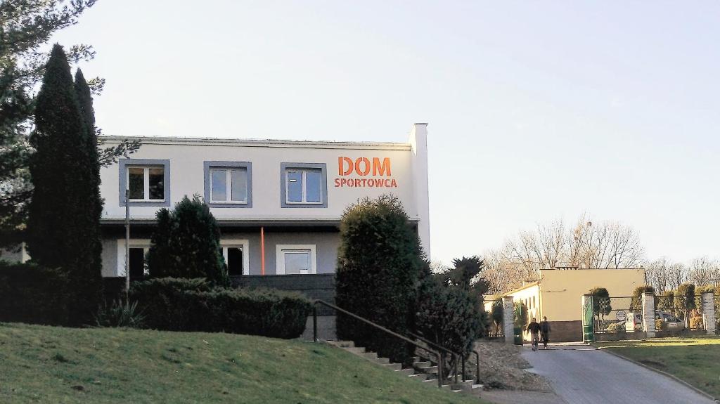 a building with a dont sign on the side of it at Dom Sportowca in Racibórz