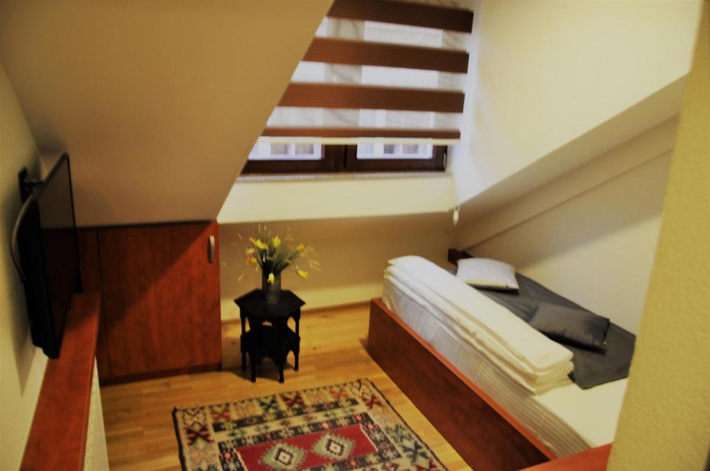 Postel nebo postele na pokoji v ubytování Hotel Noble