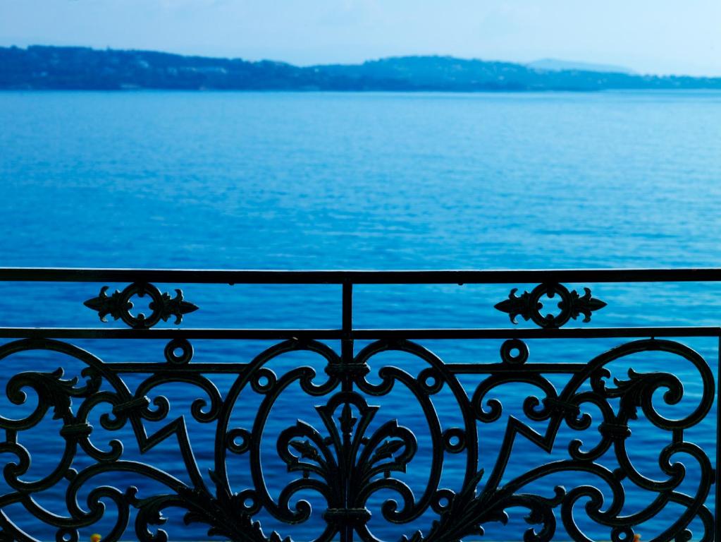 a view of the water from a balcony at Poseidonion Grand Hotel in Spetses