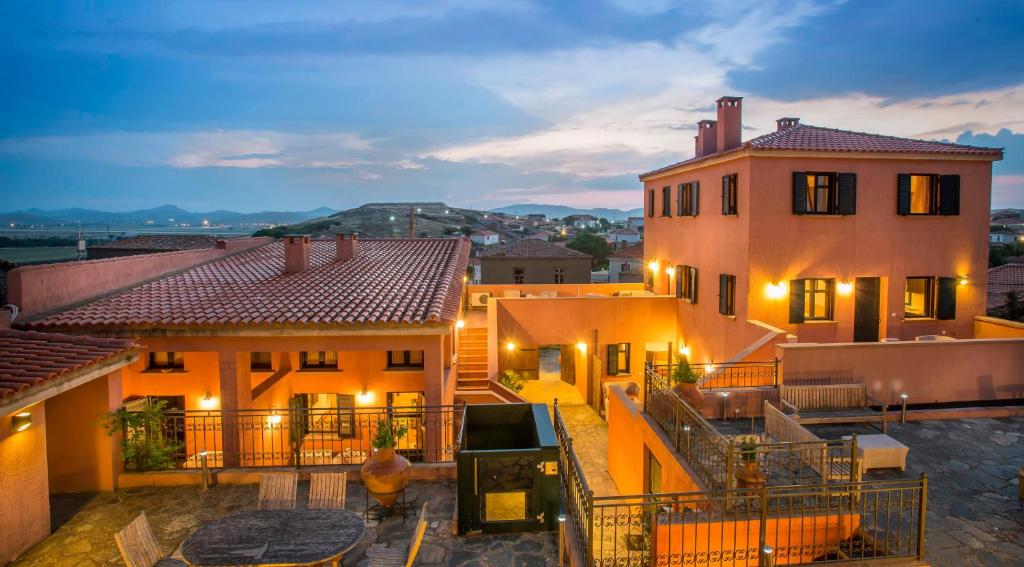 a view of a house at night with lights at The Varos Residences Hotel in Város