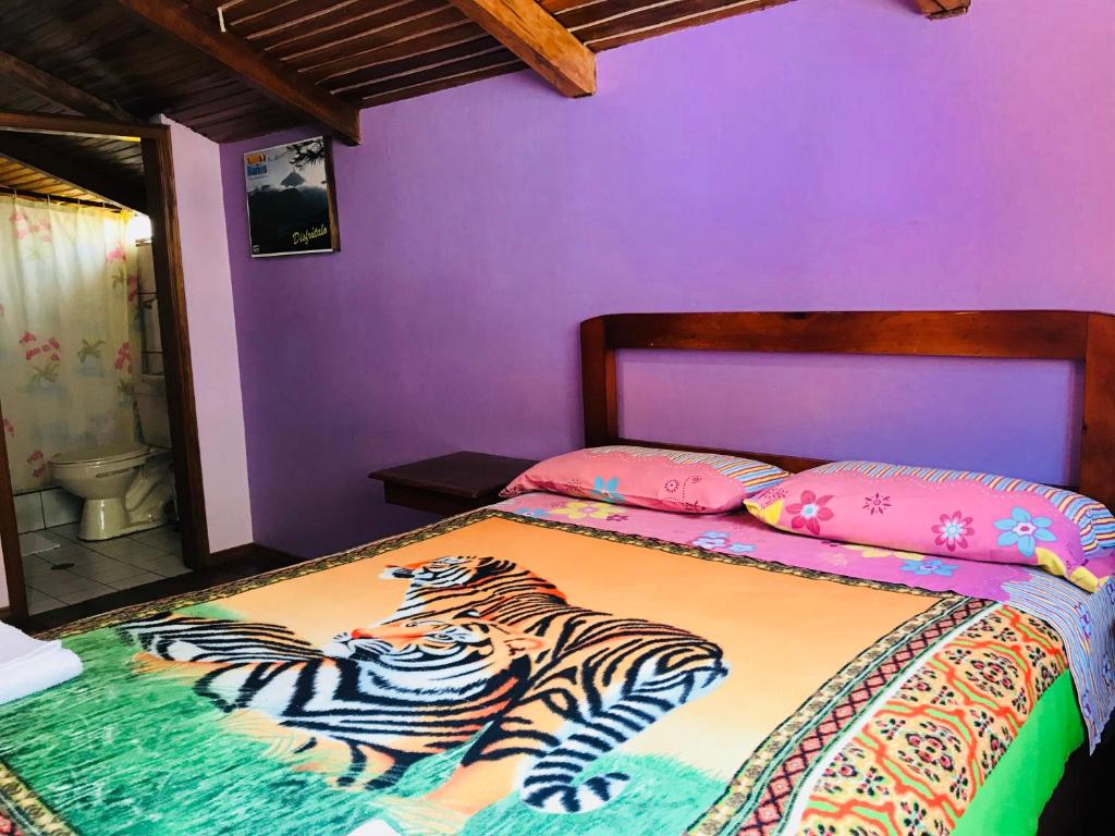 Postel nebo postele na pokoji v ubytování Hostal Princesa Maria