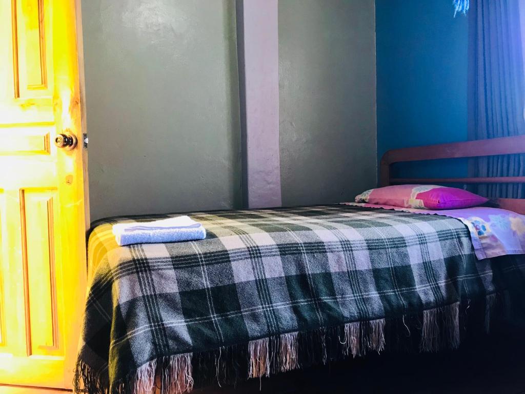 Postel nebo postele na pokoji v ubytování Hostal Princesa Maria