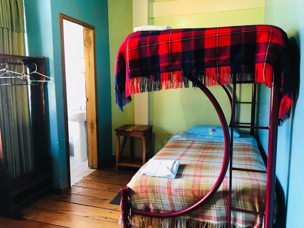 Postel nebo postele na pokoji v ubytování Hostal Princesa Maria