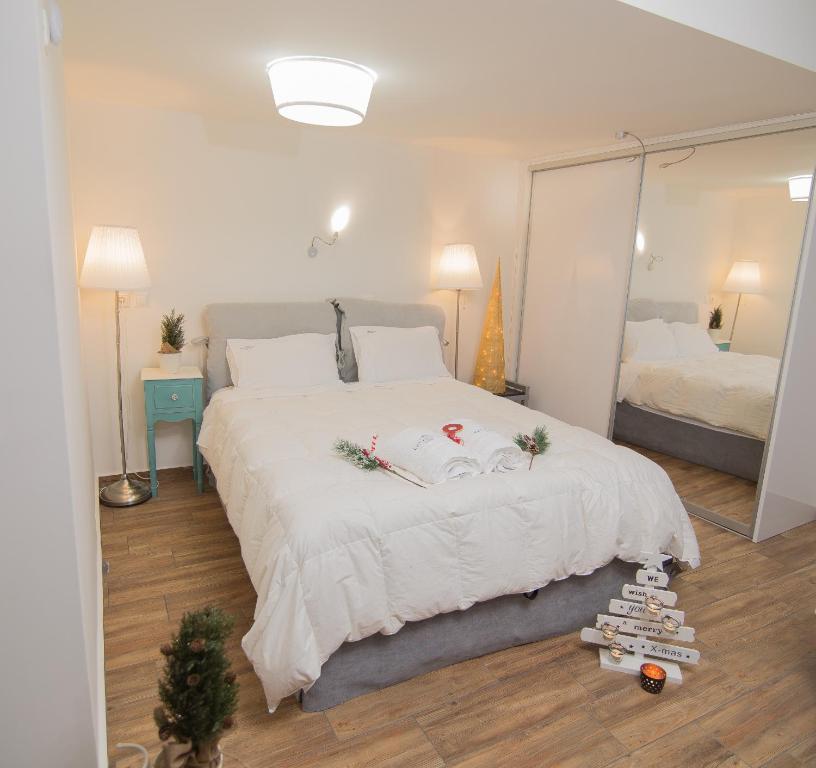 A bed or beds in a room at Kalamata Suites