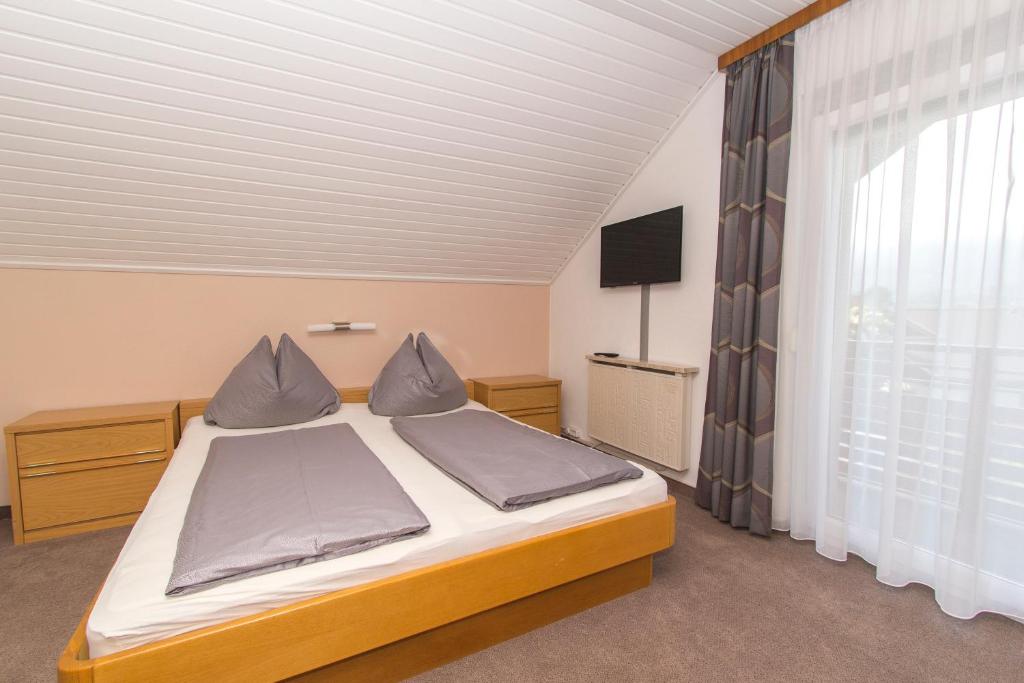 Postel nebo postele na pokoji v ubytování Gästehaus Wulz-Lesjak