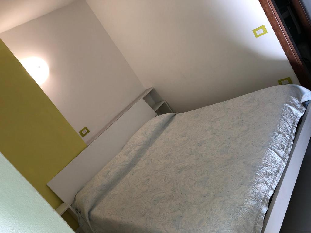 Postel nebo postele na pokoji v ubytování Albergo La Perla