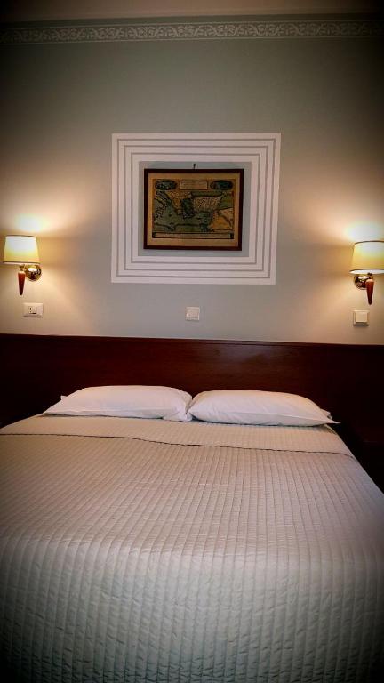 Cama o camas de una habitación en Hotel Alpi Resort