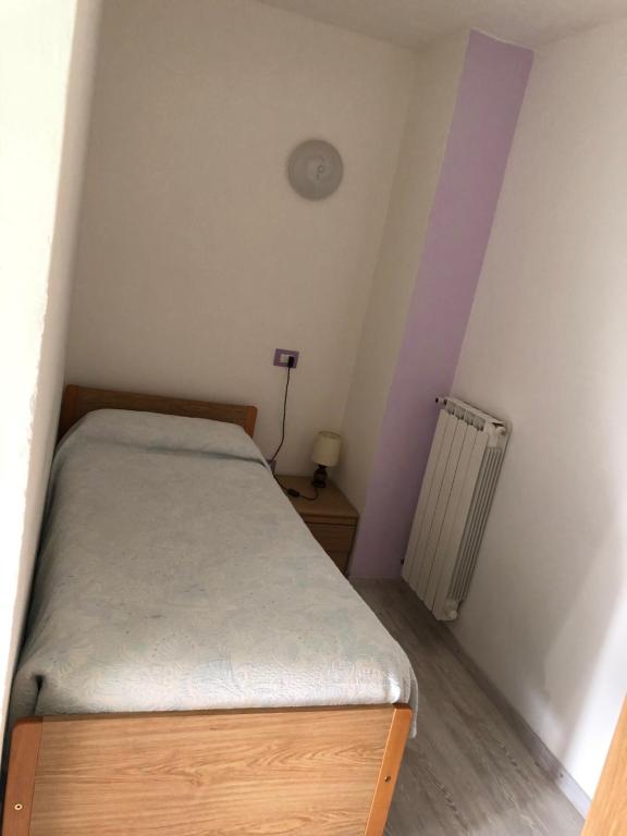 Postel nebo postele na pokoji v ubytování Albergo La Perla