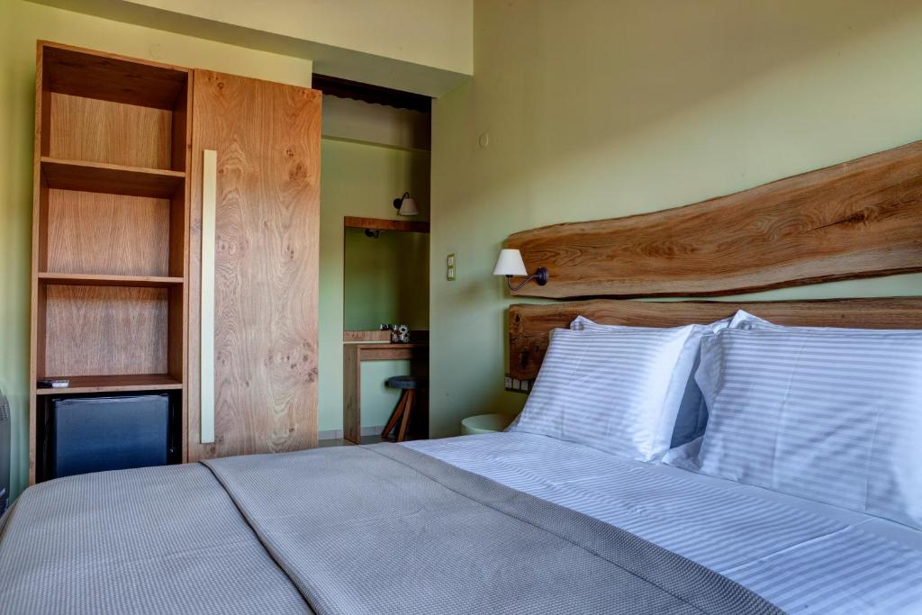 Postel nebo postele na pokoji v ubytování Elaion Terra Boutique Guesthouse
