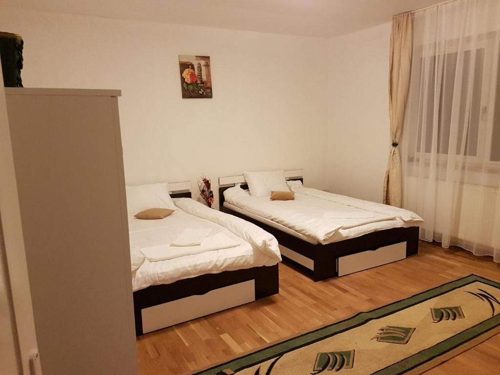 Postel nebo postele na pokoji v ubytování BigCitty Rooms