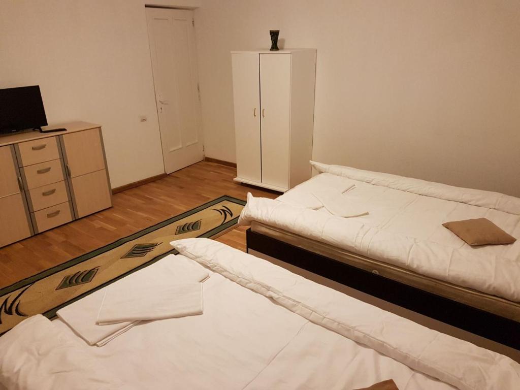 Postel nebo postele na pokoji v ubytování BigCitty Rooms