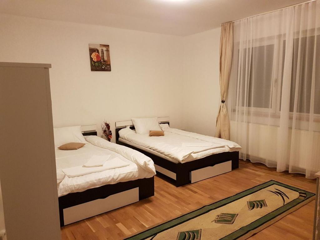 Postel nebo postele na pokoji v ubytování BigCitty Rooms