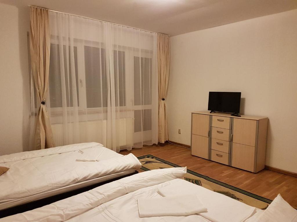 Postel nebo postele na pokoji v ubytování BigCitty Rooms
