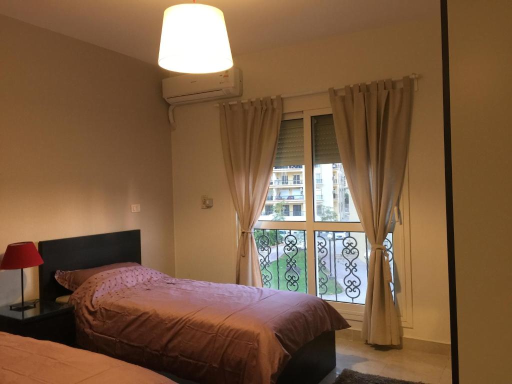 Postel nebo postele na pokoji v ubytování Al-Rehab luxury apartment Families only