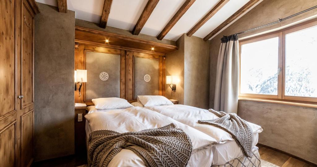 Postel nebo postele na pokoji v ubytování BelArosa Suiten & Wellness