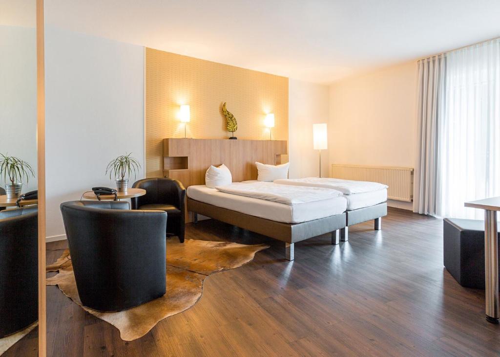Postel nebo postele na pokoji v ubytování Hotel Westerkamp