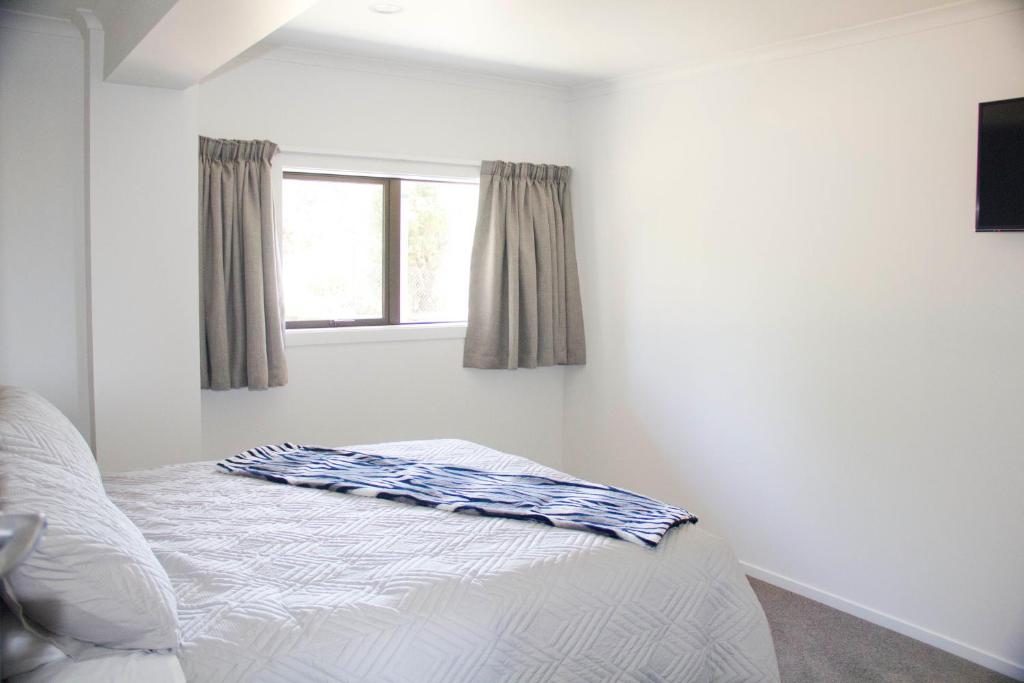 Letto o letti in una camera di Abel Tasman Kaiteriteri B & B