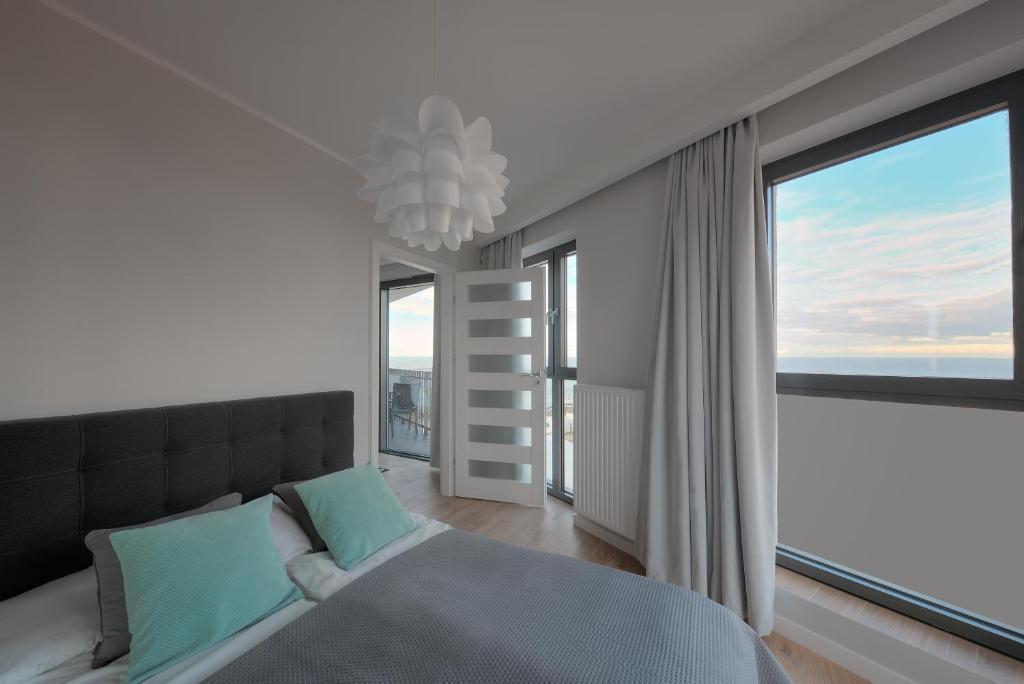 Posteľ alebo postele v izbe v ubytovaní Apartament Horyzont Amber