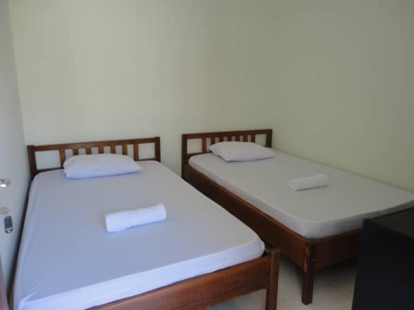 Postel nebo postele na pokoji v ubytování Jazz Senggigi Hotel