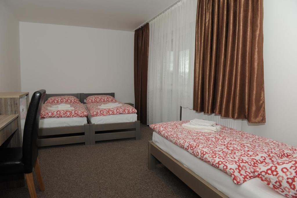 Postel nebo postele na pokoji v ubytování Penzion Panorama