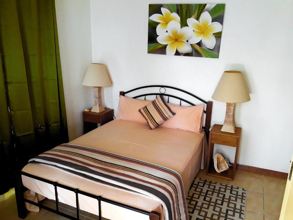 Postel nebo postele na pokoji v ubytování Flo Villa