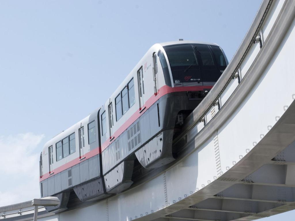a train on a bridge with a van on it at Hotel Roco Inn Okinawa in Naha
