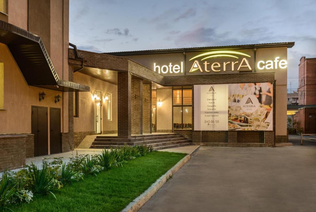 a hotel atteraire building with a sign on it at Aterrasuite Hotel in Novosibirsk