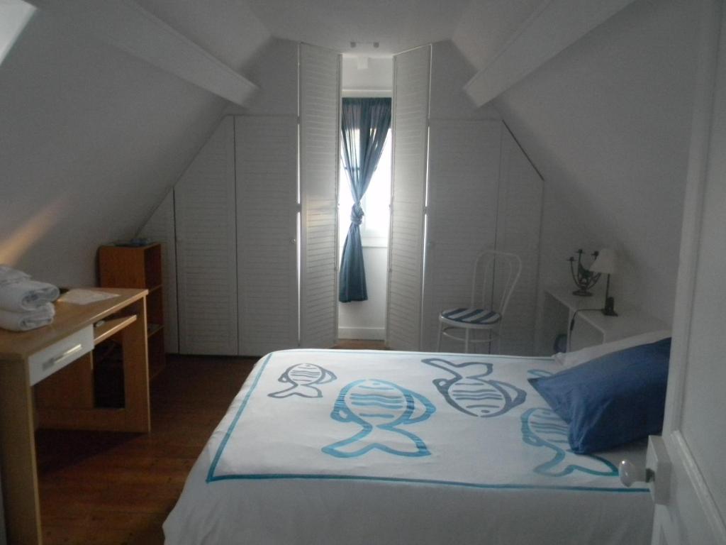 Postel nebo postele na pokoji v ubytování À l'Approche de la Mer