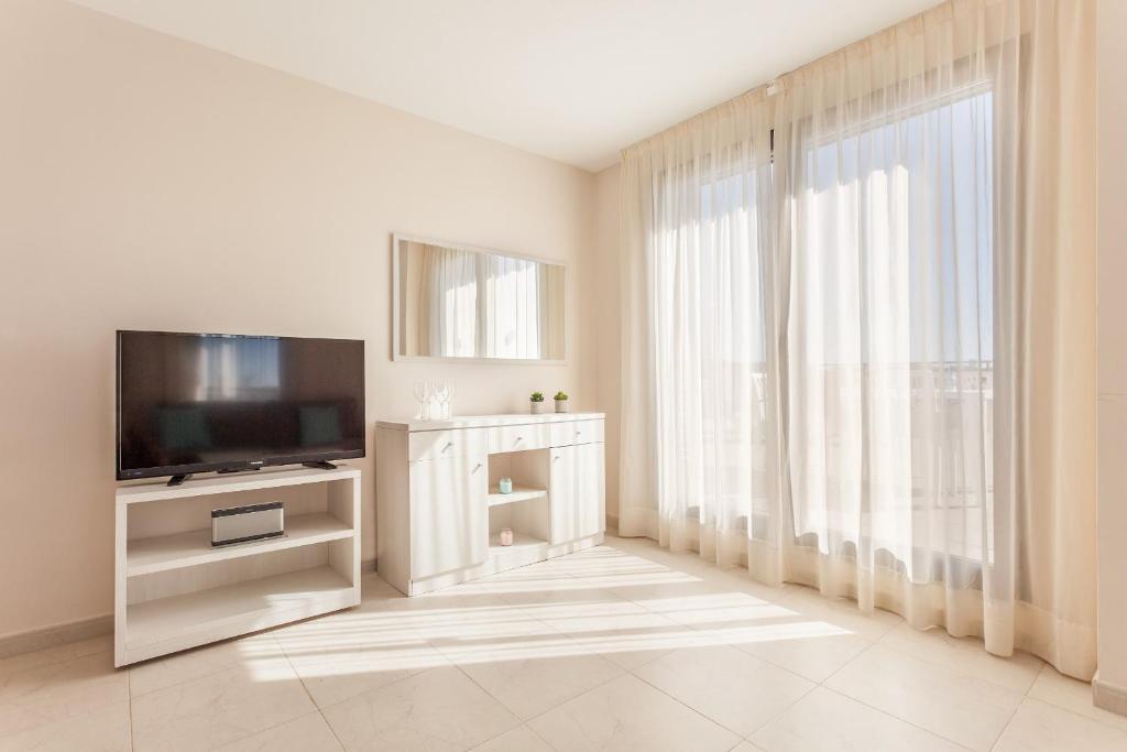 TV a/nebo společenská místnost v ubytování Pierre & Vacances Salou