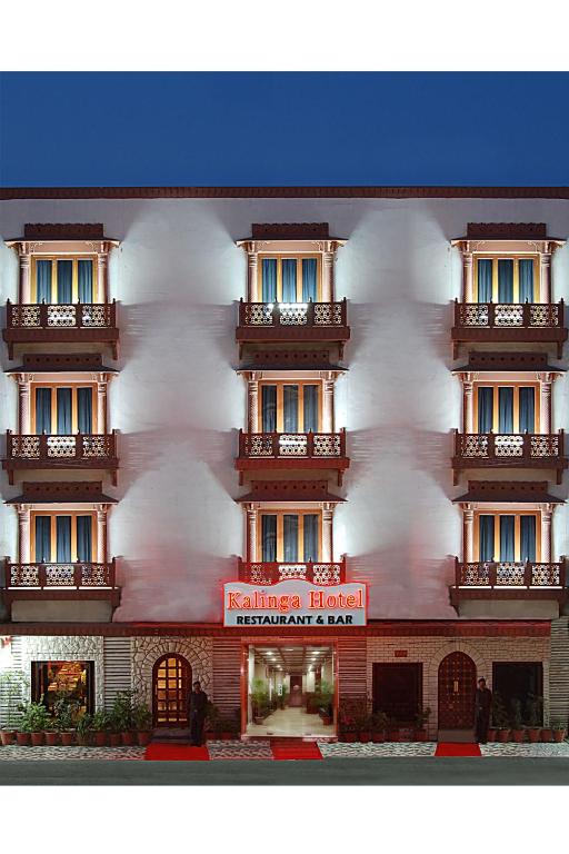 a building with a red sign in front of it at Kalinga Hotel in Jodhpur