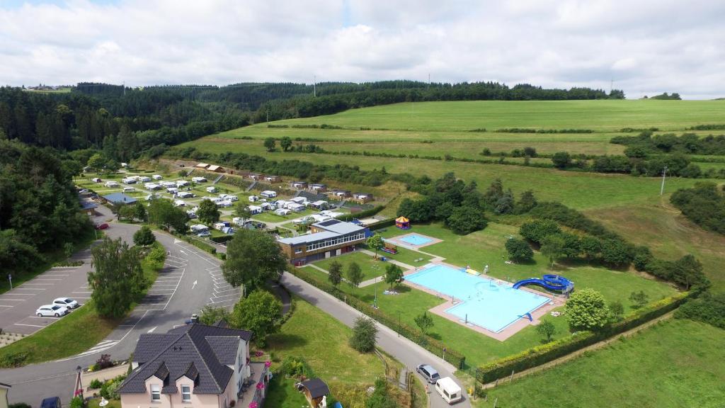 an aerial view of a resort with a pool at Camping Kaul in Wiltz