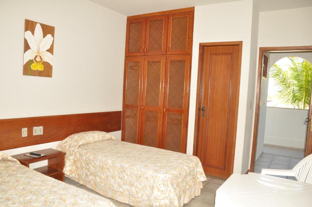 Postel nebo postele na pokoji v ubytování Quiriri Park Hotel