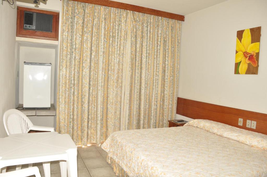 Postel nebo postele na pokoji v ubytování Quiriri Park Hotel