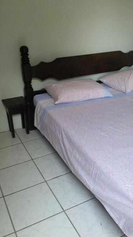 Postel nebo postele na pokoji v ubytování Residencial Ravasco